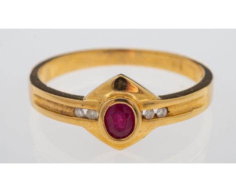 A gold ring set with oval ruby and diamonds on a gold plaque setting, ring marked 750 for 18ct  gold, weight 2.7 grams, ring 