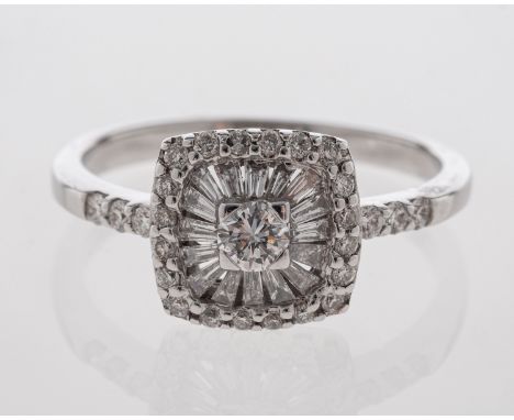 A diamond cluster ring with unusual setting of central diamond and baguette cut  diamonds in sunburst effect, diamond set sho