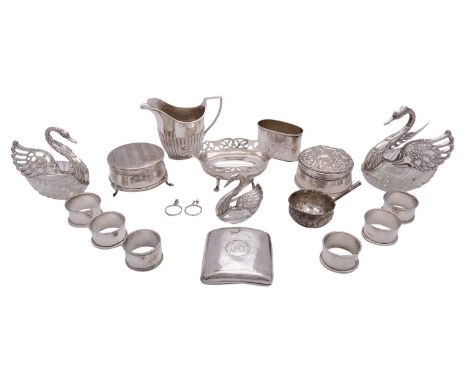 A collection of silver, including: three graduated silver and glass swan dressing table boxes, an oval bonbon dish, two dress