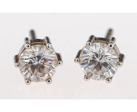 A pair of diamond single stone earrings, the brilliant cut diamonds, estimated to weigh 1.00 carat total, with post fittings.