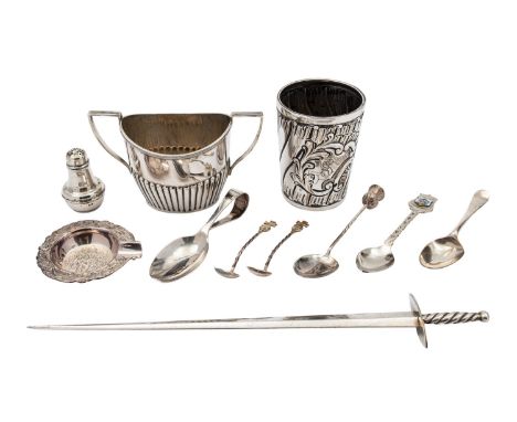 A German silver beaker, maker's mark mis-struck, post 1886 .800 standard, wrythen rocaille embossed and monogrammed to the ro