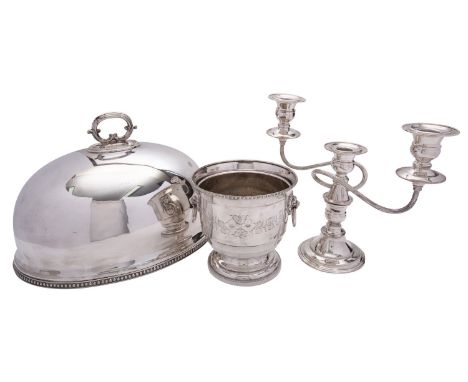 An electroplated meat dome by The Goldsmiths & Silversmiths Co. Ltd, 36cm (14in) long; a wine cooler and a three light candel