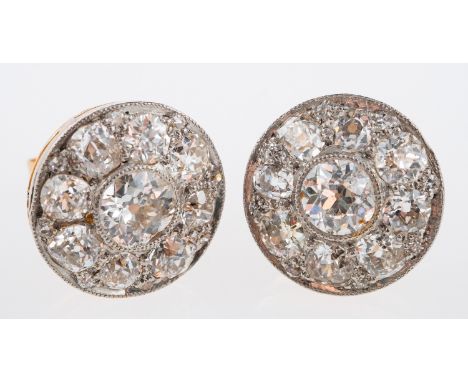 An  Edwardian diamond set earrings, set with old cut stones in a millgrain setting, the principle diamonds estimated at 0.50 