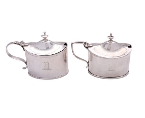 Two similar George III silver mustard pots by William Abdy II, London 1801 and 1810, each oval straight-sided, the first with