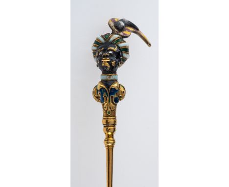 An antique gold and gem set blackamoor pin, with finely detailed feathered turban, set with rose cut diamonds and faceted gar