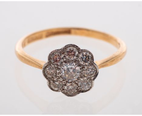 A diamond flower head cluster ring in 18ct gold, ring size M   Condition Report  Estimated diamond weight  0.60 carat 