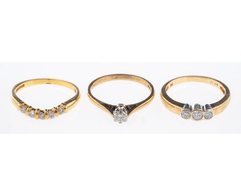 Three diamond set rings, an 18ct gold ring set with five diamonds, total diamond weight 0.25 carat, three stone ring and a so