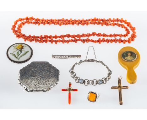 A coral bead necklace, coral cross, another in gilt metal, silver ring and white metal compact in a wooden jewellery box 