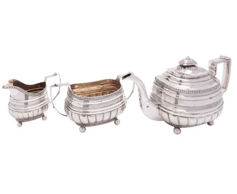 A matched George III English provincial silver three piece tea service by Simon Harris of Plymouth Dock, Exeter 1811-12, oblo