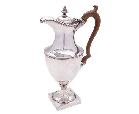 A George III silver vase shaped hot water pot by Stephen Adams II, London 1808, with a bell finial to the dome centred cover,