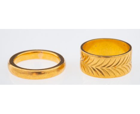 A gold wedding band with chevron pattern leaf decoration, and a plain wedding ring both 22ct, ring size L     Condition Repor