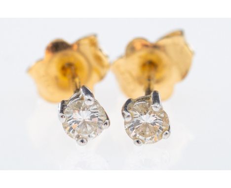 A pair of diamond solitaire earrings, brilliant cut diamonds, total 0.20 carats, gold posts, boxed    Condition Report posts 