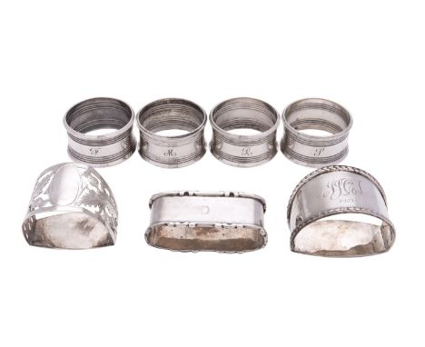 A set of four silver circular napkin rings by Harman Brothers, Birmingham 1960, initialled; a D section napkin ring by Robert