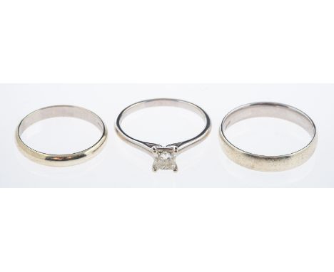 A princess cut diamond solitaire ring, diamond of 0.50 carat set in 18ct  white gold, ring size P & two 9ct white gold bands,
