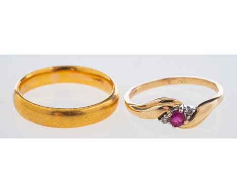 A gold ring set with a small ruby and diamond points ring size k and a gold wedding band, 22 ct, ring size L Condition Report