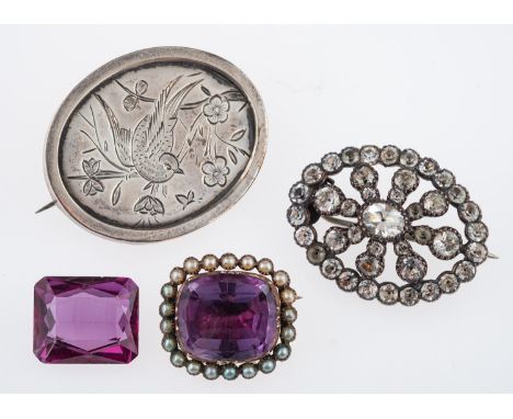 A 19th Century amethyst and pearl brooch, unmarked gold, closed back setting, a silver aesthetic style brooch engraved with a