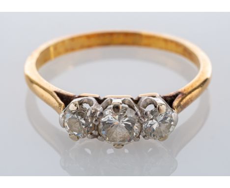 A diamond three stone ring, set with three brilliant cut diamonds, approximately 0.50 carats total, ring size N