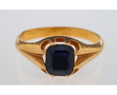 A violet blue sapphire set ring, the faceted stone set in high carat gold, claw setting with closed back, Weight 3.7 grams, r