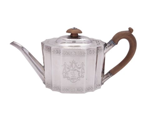 A George III silver tea pot by Joseph Scammell, London 1790, with an oval wooden finial to the dome centred cover, a wooden l