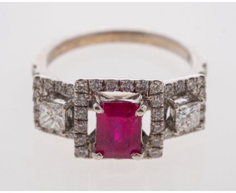 A 1940's style ruby and diamond ring with central step cut ruby and square cut diamonds, all within a boarder of square brill