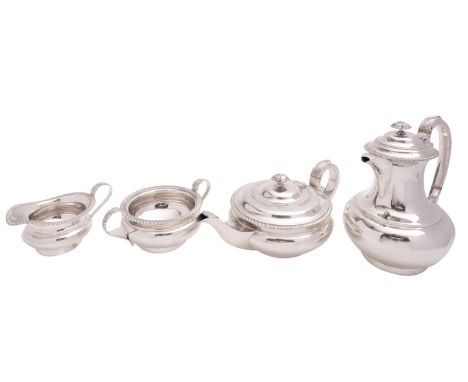 A matched silver four-piece tea service by William Hutton & Sons Ltd, Sheffield 1912, 1913 and 1932, the tea and hot water po