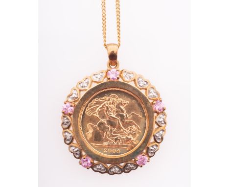 An Elizabeth II half sovereign coin in gold mount with heart form diamond settings and pink sapphires, on fine chain marked 9