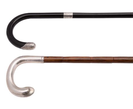 Two silver mounted walking sticks, the first palmwood with a plain silver covered handle by Schick & Wright, London 1910, mon
