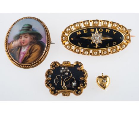 Three antique brooches, a heart charm, a gold diamond and black enamel memorial brooch with gold lettering 'In Memory of ' an