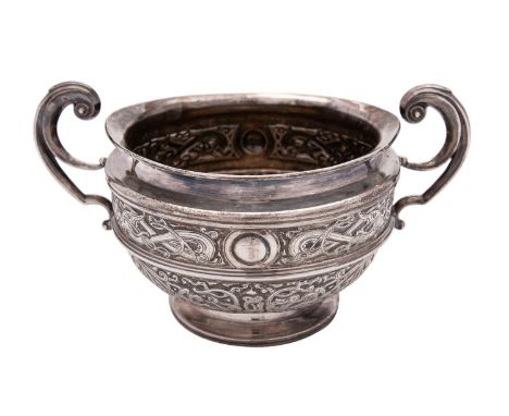 An Edwardian silver sugar basin by The Goldsmiths & Silversmiths Co. Ltd, London 1903, with twin tongue-capped scroll handles