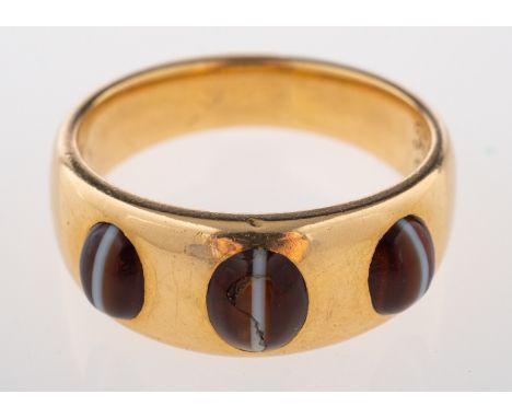 A late Victorian 18ct gold banded onyx ring