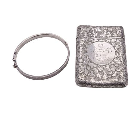 A Victorian silver card case by Sampson Mordan & Co., London 1883, rounded rectangular and scroll foliate engraved, presentat