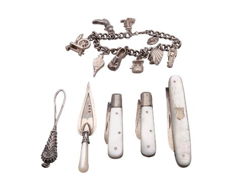 A small group of silver items, including a silver and mother of pearl page marker in the form of a trowel, with a pair of sma