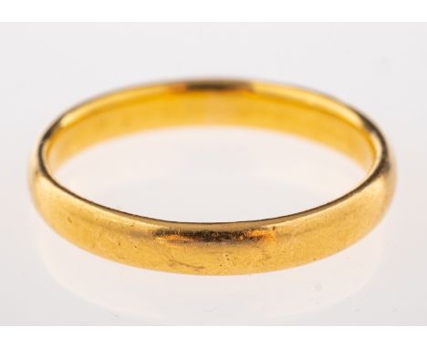 A 22ct gold wedding band, stamped 22 with full London hallmarks, ring size M, 3.3g