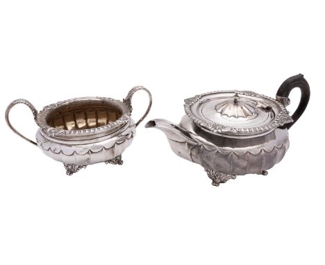 A Victorian silver tea pot by Charles Stuart Harris, London 1886, compressed circular with an ebonised loop handle, a dome ce