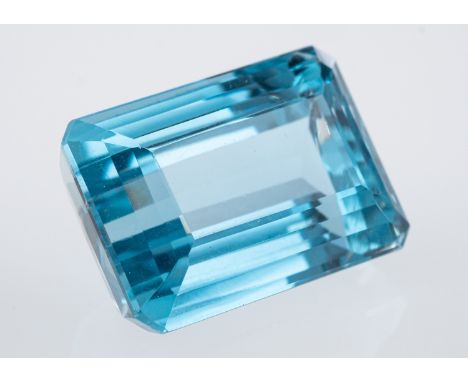 A Brazilian blue topaz of good colour, the step cut rectangular stone of around 23 carats. Condition Report Good condition, s