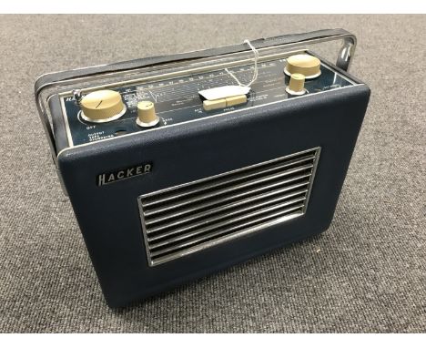 A vintage radio : Hacker VHF Herald, model RP 37A, in a blue case. 