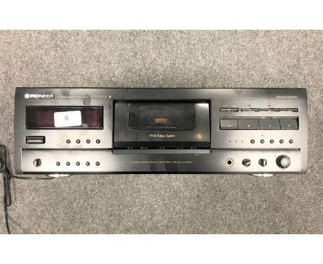A Pioneer stereo cassette deck, CT-S830S, with manual.