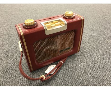 A vintage radio : Eveready Skymaster in red case. 