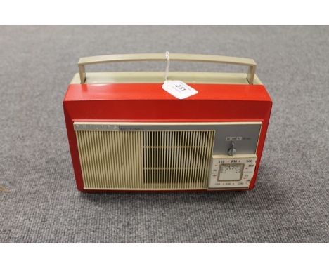 A vintage radio : Philips portable radio in red case. 