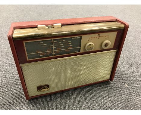 A vintage radio : HMV transistor 7 in red case. 