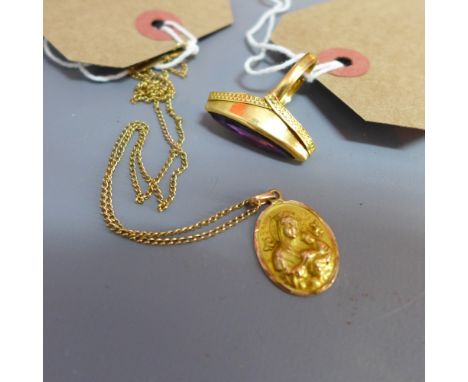 An 18ct gold and amethyst ring together with an oval pendant depicting Madonna and child, on a chain marked 9ct 