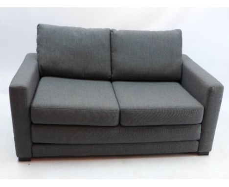 A contemporary John Lewis two seater sofa bed, upholstered in grey, raised on block supports, H 80 x W 141 x D 83cm 