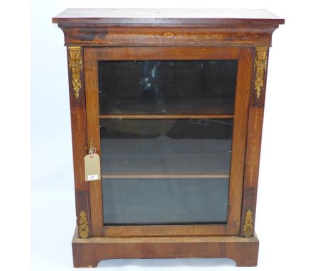A 19th century walnut and satinwood inlaid pier cabinet with ormolu mounts and raised on carved bracket feet, H 106 x W 83 x 