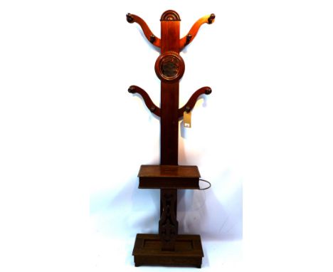 An early 20th century oak hall stand inset with mirror and raised on carved bracket feet, H 185 x W 63 x D 25cm 