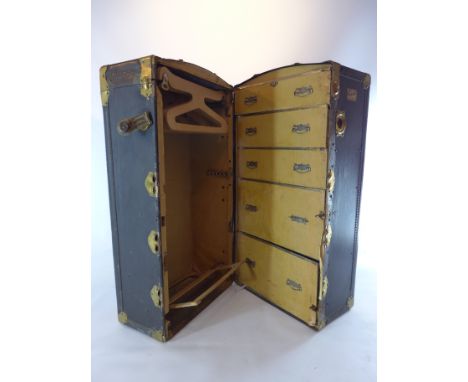 A 19th century 'Orderlee Wardrobe Trunk', brass bound with leather handles and fitted interior 