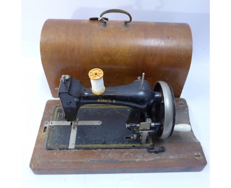 A walnut cased sewing machine stamped 'Harris K', H 26 x W 46 x D 23cm 