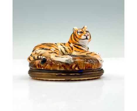 A trinket box that depicts a tiger sitting on top of a savanna rock with the bottom half containing the lid. Halcyon Days bac