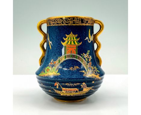 A blue painted vase that has a pagoda and bridge as the main centerpiece of the vase with some other features such as a boat 