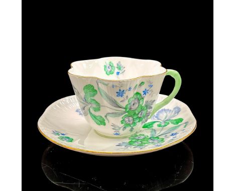 Vintage white bone china with calm green and blue flowers, gilt rims. Dainty shape. Tea cup 4"L x 3.5"W x 2.5"H. Saucer 0.75"