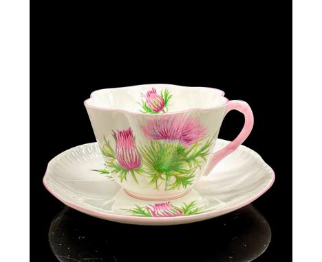 Vintage white bone china with purple and pink flowers, pink rims. Dainty shape. Tea cup 4"L x 3.5"W x 2.5"H. Saucer 0.75"H x 